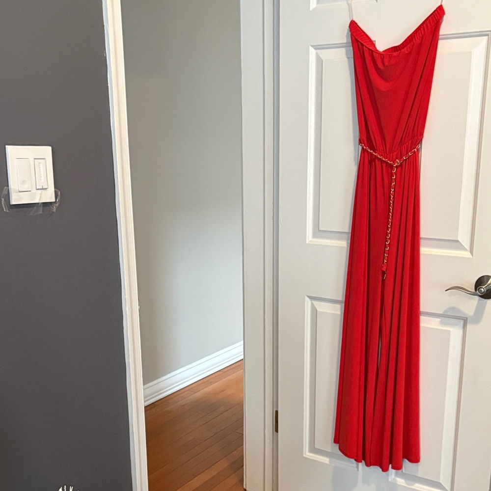Elegant Red Strapless Jumpsuit with Chain Detail